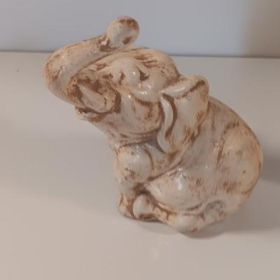 Vintage tabletop ceramic elephant plant stand with smaller chalkware elephant.
