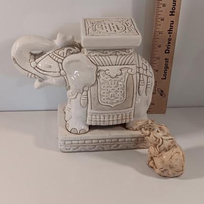 Vintage tabletop ceramic elephant plant stand with smaller chalkware elephant.