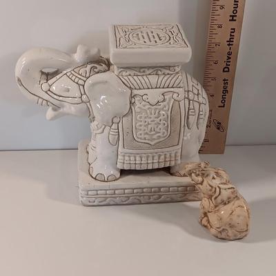 Vintage tabletop ceramic elephant plant stand with smaller chalkware elephant.