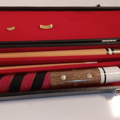 Vintage red and black pool cue with pearl white dots - turns into 2 different sizes
