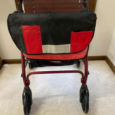 Red walker with seat