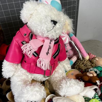 Dolls from Around The World, Including An Elvis Presley Bear in a Pink Leather Jacket 
