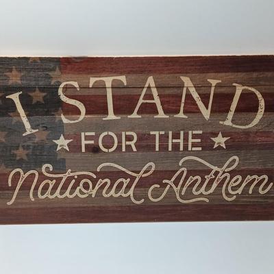 Wooden wall art I Stand FOR THE NATIONAL ANTHEM with American flag background..