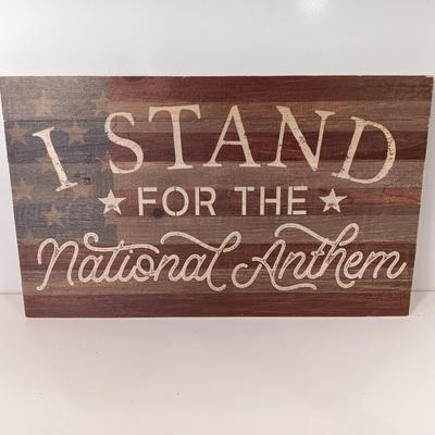 Wooden wall art I Stand FOR THE NATIONAL ANTHEM with American flag background..