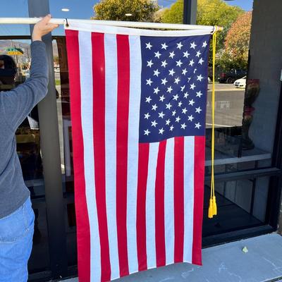 LARGE U.S. FLAG WITH GOLD BRAID TASSLES ON POLE