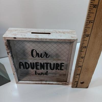 Adventure awaits! wooden accent light, and a Save for your next Adventure glass front wood framed fund bank
