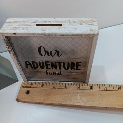 Adventure awaits! wooden accent light, and a Save for your next Adventure glass front wood framed fund bank