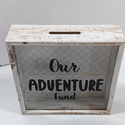 Adventure awaits! wooden accent light, and a Save for your next Adventure glass front wood framed fund bank