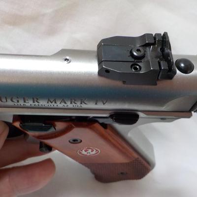 " Ruger Mark 1V Hunter , 22 cal pistol"' est. $500 to $810.