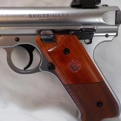 " Ruger Mark 1V Hunter , 22 cal pistol"' est. $500 to $810.