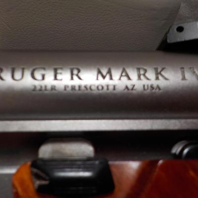 " Ruger Mark 1V Hunter , 22 cal pistol"' est. $500 to $810.