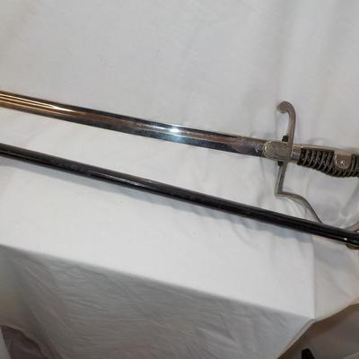 Original WW2 German Army M1890 NCO Sword and scabbard. est . $200 to $800.