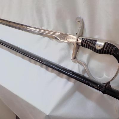 Original WW2 German Army M1890 NCO Sword and scabbard. est . $200 to $800.