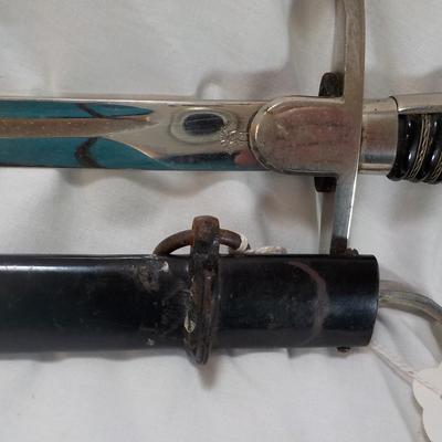 Original WW2 German Army M1890 NCO Sword and scabbard. est . $200 to $800.