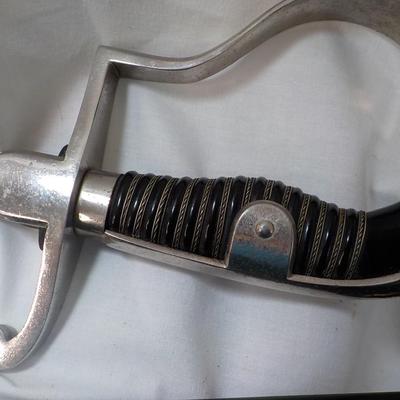 Original WW2 German Army M1890 NCO Sword and scabbard. est . $200 to $800.