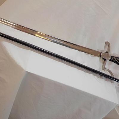 Original WW2 German Army M1890 NCO Sword and scabbard. est . $200 to $800.
