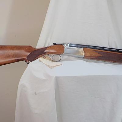 " Ruger Red Label Over and Under 12 Ga. Shot Gun. est. $700 to $1200..