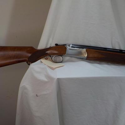 " Ruger Red Label Over and Under 12 Ga. Shot Gun. est. $700 to $1200..