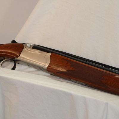 " Ruger Red Label Over and Under 12 Ga. Shot Gun. est. $700 to $1200..