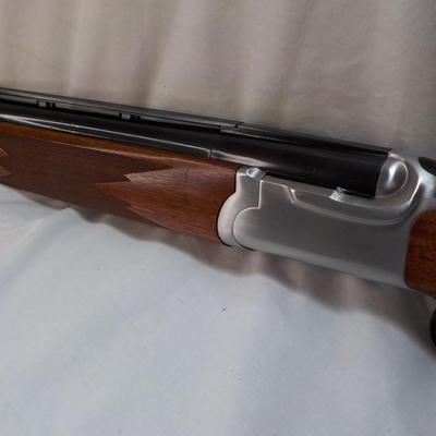 " Ruger Red Label Over and Under 12 Ga. Shot Gun. est. $700 to $1200..