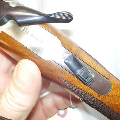 " Ruger Red Label Over and Under 12 Ga. Shot Gun. est. $700 to $1200..