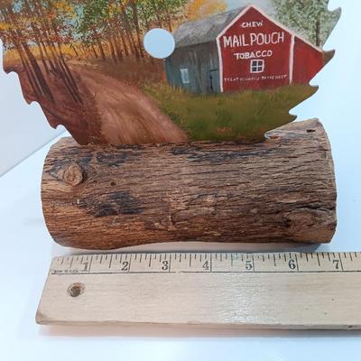 Hand painted saw blade signed by artist Chew Mail Pouch Tobacco barn with log display
