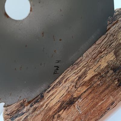 Hand painted saw blade signed by artist Chew Mail Pouch Tobacco barn with log display