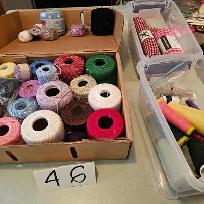 Box of embroidery thread, and fabric remnants