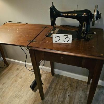 New willard sewing machine with foot petal in wooden cabinet, works