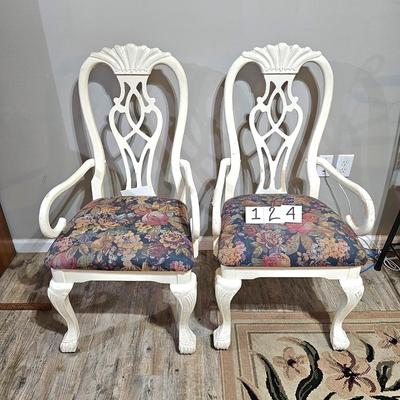 2 white sturdy chairs