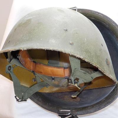 U.S.Army Early Viet Nam Helmut/ rice paddie stain. Liner also. est. $30 to $100.