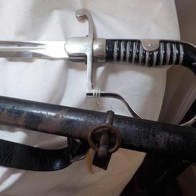 WW2 German NCO Sword. with Tasle connector. est. $150 to $400.