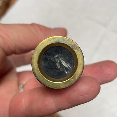 Metal kaleidoscope in velvet case.