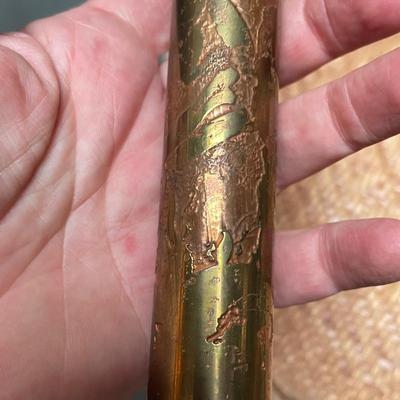 Metal kaleidoscope in velvet case.