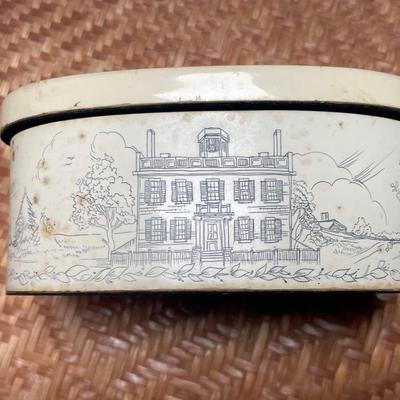 Composite box with eagle, house, and script.