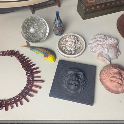 Lot of assorted Faces, paperweights, plate, boat, box.