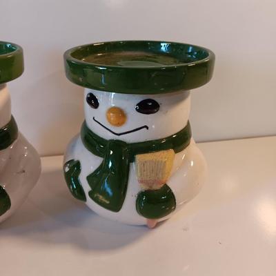 Two matching snowman pillar candle holders