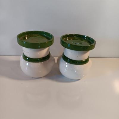 Two matching snowman pillar candle holders