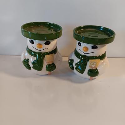 Two matching snowman pillar candle holders