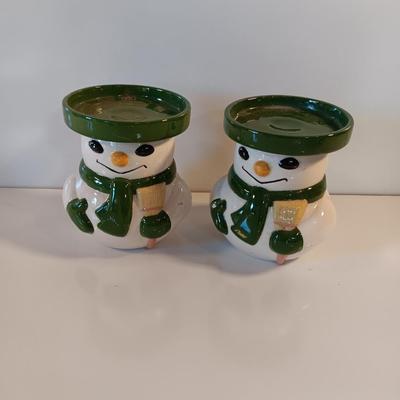 Two matching snowman pillar candle holders