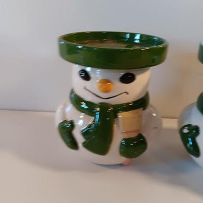 Two matching snowman pillar candle holders
