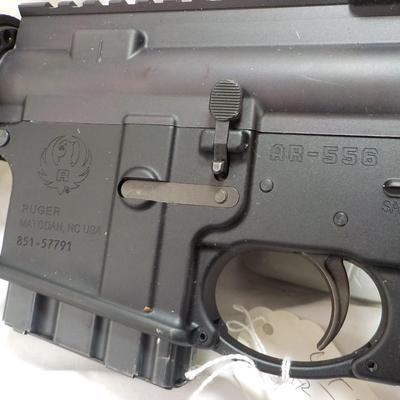 Ruger AR 556 semi auto rifle, 10 round, est. $300 to $900.