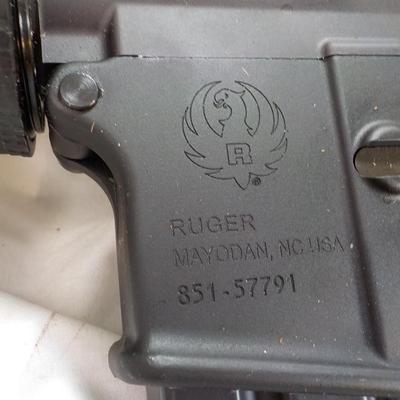 Ruger AR 556 semi auto rifle, 10 round, est. $300 to $900.