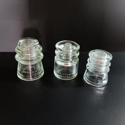 Three clear glass Hemingray Glass Insulators