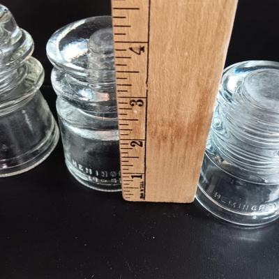 Three clear glass Hemingray Glass Insulators