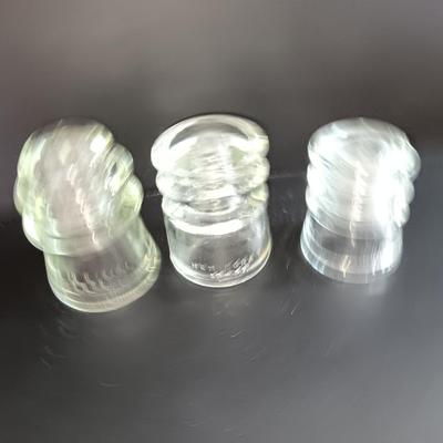 Three clear glass Hemingray Glass Insulators