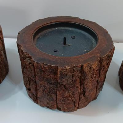 Three rustic wooden pillar candle holders