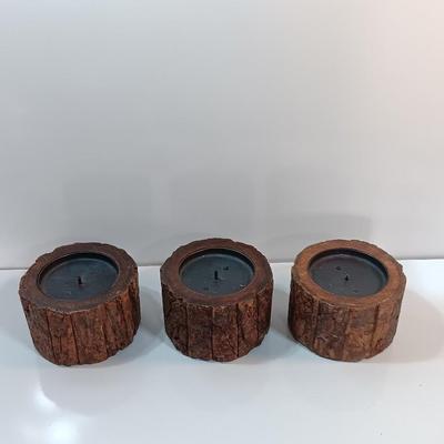 Three rustic wooden pillar candle holders