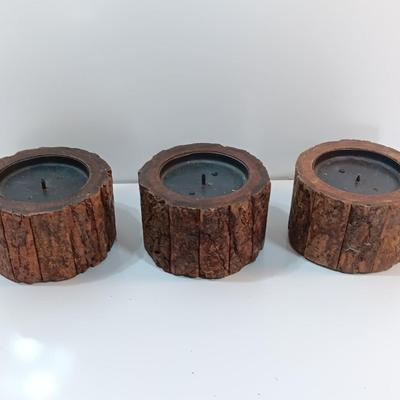 Three rustic wooden pillar candle holders