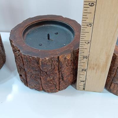 Three rustic wooden pillar candle holders